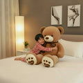 Ours en peluche marron clair de 80 cm de la marque Petit-Ours, doux et moelleux, parfait pour les câlins.
