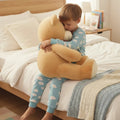 Ours en peluche marron foncé de 60 cm de la marque Petit-Ours, doux et câlin, posé debout avec un sourire accueillant.
